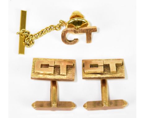 A pair of 9ct yellow gold textured cuff links set with initials 'CT' to the rectangular platform with matching tie pin, combi