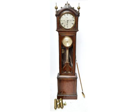 An early 19th century Irish mahogany and brass inlaid chiming longcase clock, the shaped pediment above silvered dial set wit