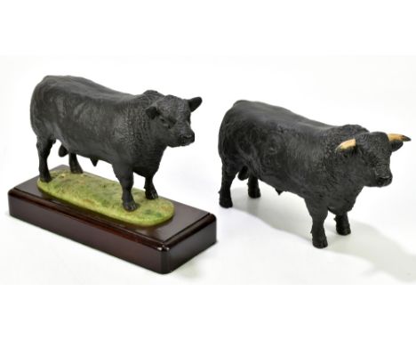 JOHN HARPER FOR SHEBEG POTTERY, ISLE OF MAN; a model of a bull on rectangular plinth base, length 27cm, together with a simil