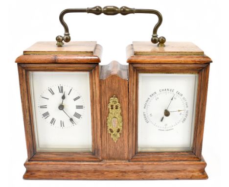 An early 20th century oak cased combination carriage clock/thermometer, each with enamelled dials, with broken swan neck hand