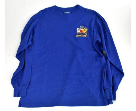 BOBBY CHARLTON; a retro style long sleeve Manchester United shirt, signed to the reverse and inscribed 'good luck', size XL.A