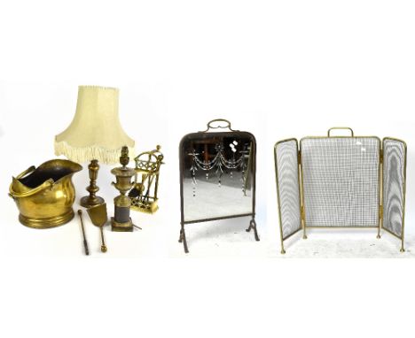 An Empire style brass lamp, 35cm, with another lamp, a brass coal bucket, two fire screens, a matched companion set, etc.
