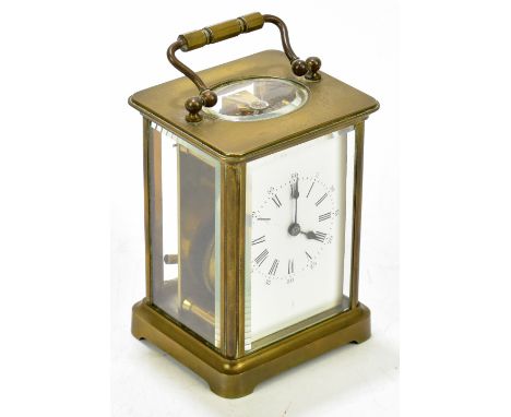 A brass cased carriage clock with Roman numerals, height 11cm.