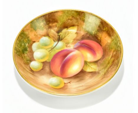 HOLLAND FOR ROYAL WORCESTER; a hand painted circular pin dish decorated with fruit, black painted mark to the underside, diam