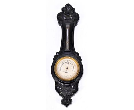 REYNOLD &amp; BRANSON LTD OF LEEDS; a miniature aneroid barometer in ebony case in the form of a wheel barometer with silvere