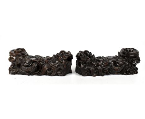A pair of Chinese carved hardwood figures of Dragons, length 27cm.&nbsp;Additional InformationMinor chipping and losses, ligh