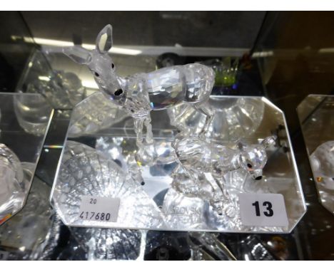 Two Swarovski figures, Doe A7608 NR 000 003 and Fawn A 7608 NR 000 002. Boxed with a display mirror. 