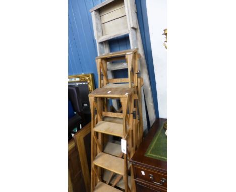 Three vintage wooden step ladders. 