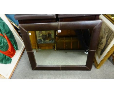 A leather framed mirror. 73cm x 53cm 