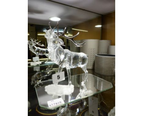 A Swarovski crystal stag with silvered antlers. Boxed plus display mirror. 