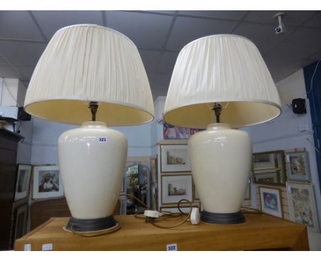 Two large cream ceramic lamps with matching cream shades 