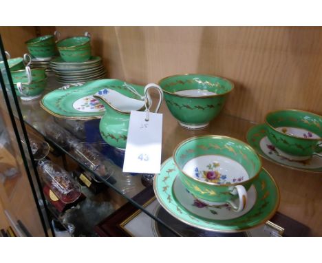 A mid-19th century English porcelain part tea service in the manner of Coalport   comprising a cream jug, slop bowl, cake pla