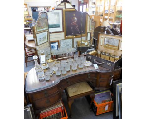 A 1930's walnut inverted bow fronted dressing table with triple mirror and matching stool (2) 