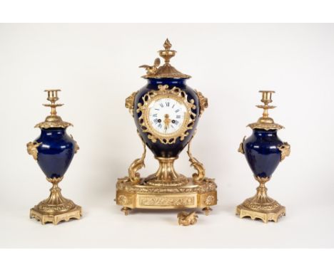 REPRODUCTION GILT METAL AND BLUE GLAZED PORCELAIN THREE PIECE CLOCK GARNITURE, the clock with 4" enamelled dial powered by a 