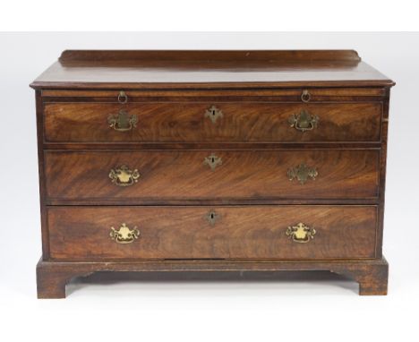 LATE EIGHTEENTH CENTURY FIGURED MAHOGANY CHEST OF DRAWERS OF WIDE PROPORTIONS, the moulded oblong top with short back above a