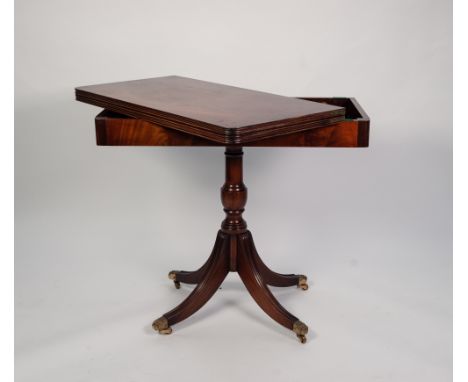 BEVAN & FUNNELL REGENCY STYLE MAHOGANY PEDESTAL CARD TABLE, the rounded oblong fold over top with reeded border and green bai