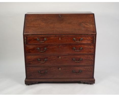 GEORGE III MAHOGANY BUREAU, of typical form with four graduated and cockbeaded drawers, fitted with heavy brass swan neck han