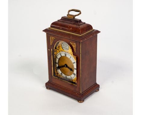 A LATE GEORGE VI CHARLES FRODSHAM WALNUT AND GILT BRASS MOUNTED MINIATURE BRACKET CLOCK,  the arched brass dial with silvered