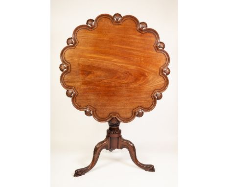 A FINE GEORGE III MAHOGANY TRIPOD TEA TABLE, the revolving and tilting 'birdcage' one piece top formed of twelve pie-crust ed