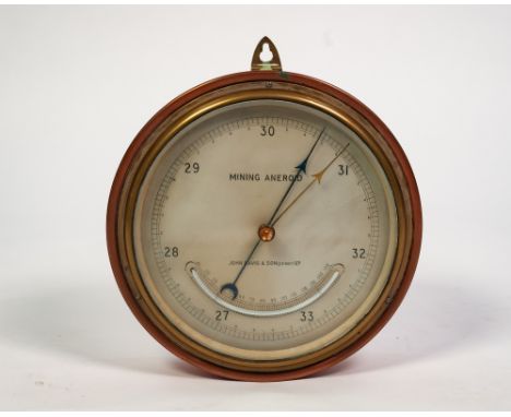 AN INTER-WAR YEARS JOHN DAVIS AND SON (Derby) Ltd. COPPER AND BRASS CASED WALL MOUNTED MINING ANEROID BAROMETER, with thermom