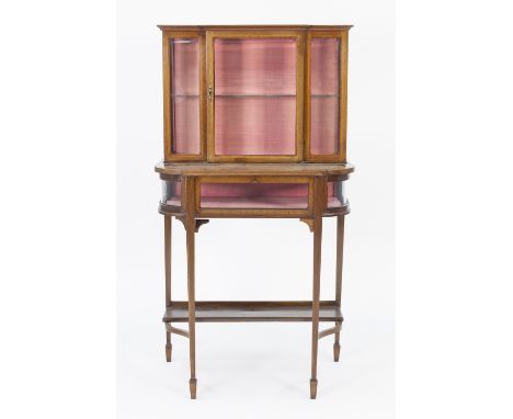 EARLY TWENTIETH CENTURY LINE INLAID MAHOGANY BIJOUTERIE AND DISPLAY CABINET, the breakfront oblong top above a glazed cupboar