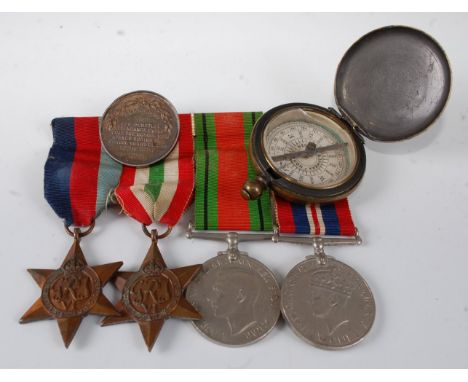 A group of four WW II medals to include 1939-45 Star, Italy Star, Defence and War together with a Victorian West Ham school a