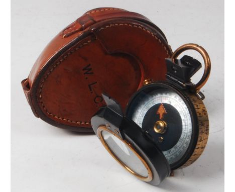 A WW I period private purchase brass and lacquered cased marching compass having a mother of pearl dial, stamped verso Cary 7