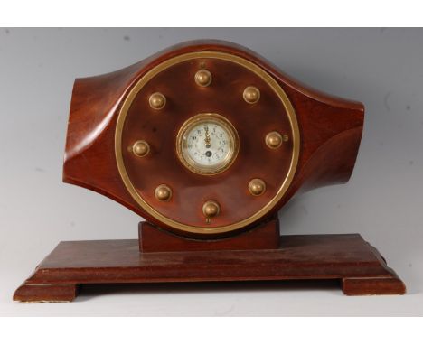 An early 20th century propeller mantel clock, having an enamel dial with Arabic numerals set within the boss of a Parnell Pan