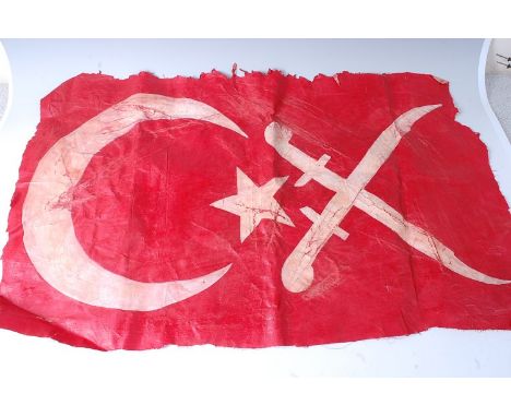 A patch of canvas with Turkish Crescent and Star with further crossed swords, 60 x 95cm.