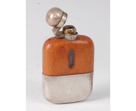 An early 20th century hip flask, having a leather covered glass body with silver plated mounts and removeable cup, by James D