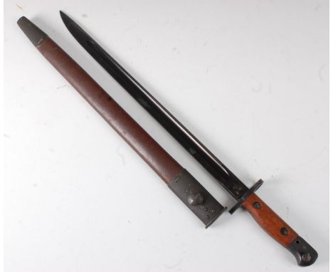 An Australian 1907 pattern bayonet, having a 43cm blackened single edged fullered blade stamped to the ricasso 1907 42 and XM
