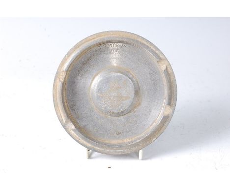 An R.A.F. Battle of Britain commemorative ashtray made from the piston of a Rolls Royce Merlin.