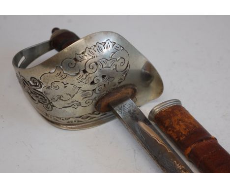 A Geo. V. 1897 pattern Infantry Officer's sword, the 83cm fullered blade etched with a crowned GRV cypher, having a typical p