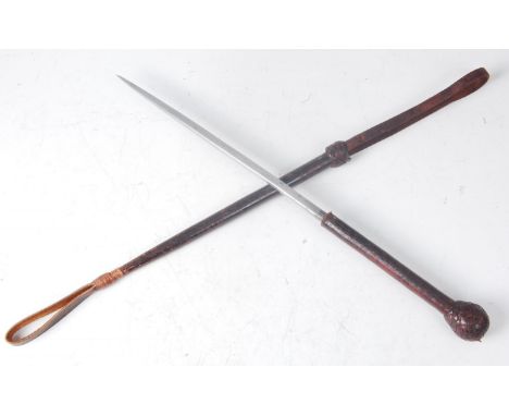 An early 20th century riding crop/sword stick, having a leather covered shaft revealing a 24.5cm steel blade, 50cm.