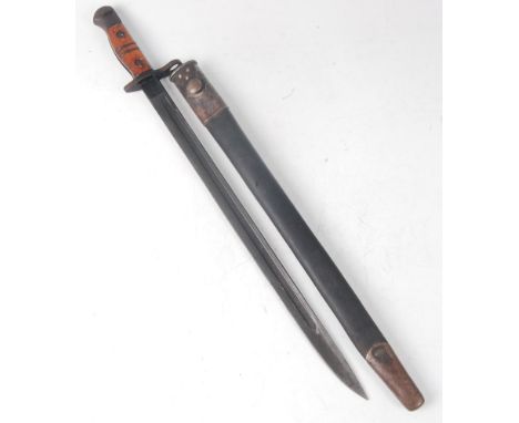 A 1913 pattern Remington bayonet, the 43cm single edged fullered blade stamped to the ricasso 11 16 with various ordnance mar