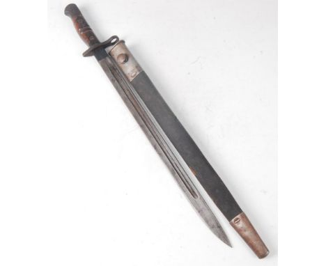 A 1913 pattern Remington bayonet, the 43cm single edged fullered blade, stamped to the ricasso 1 17 with various ordnance mar