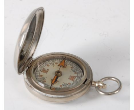 A WW I military issue nickel cased pocket compass stamped W.F. Holmes Birmingham VI 42931 and dated 1918.