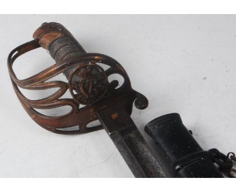 An 1854 pattern Light Infantry Officer's sword, the 83cm blade etched wirth a crowned VR cypher within foliage, having a bras