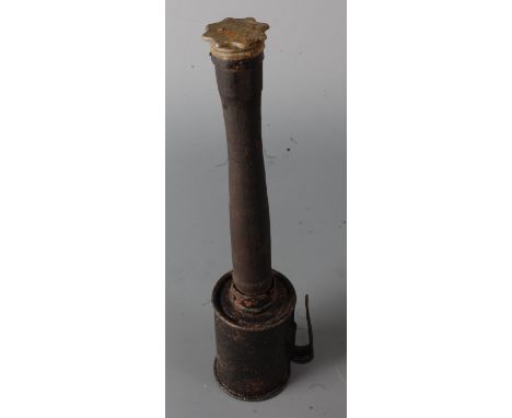 A deactivated WW I German stick grenade with wooden shaft.