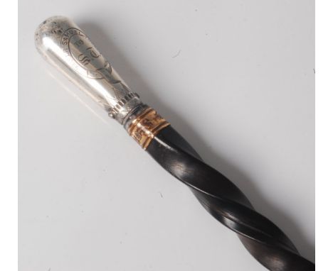 A 19th century swagger stick, having a spirally turned whale bone shaft with gilt metal collar and white metal tip inscribed 