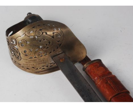 An 1897 pattern Infantry Officer's sword, having a 82.5cm blade etched with a crowned GR cypher within foliage, the pierced s