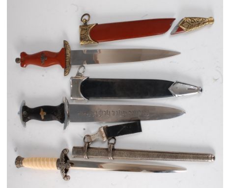 A reproduction German Heer dagger, the 25.5cm blade marked F.W. Holler, Berlin, the crossguard with eagle emblem, having a wh