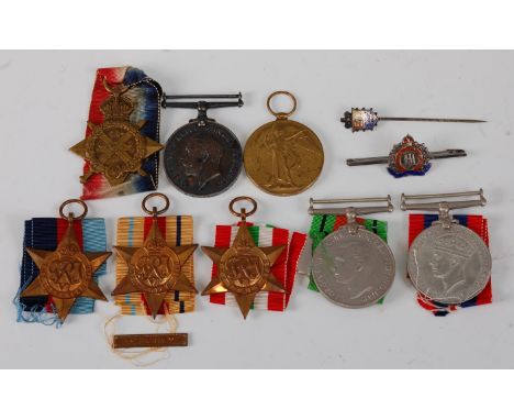 A family group of medals and effects to include WW I 1914 Mons Star, British War and Victory medals, naming 2007 PTE. H.A. FI