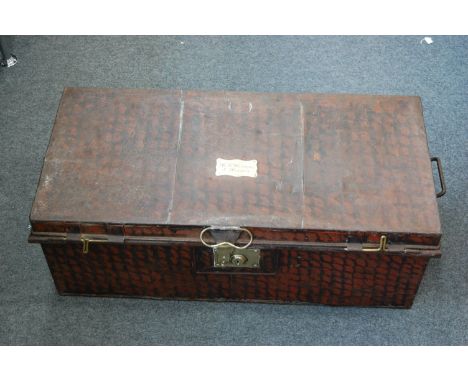 A WW I period jappaned tin uniform trunk, having a brass plaque inscribed "H.K.D. Evans 4th Hussars" for Captain H.K.D. Evans
