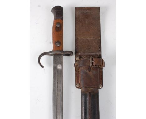 A British 1907 pattern bayonet, the 43cm single edged fullered blade stamped to the ricasso with a crowned ER cypher 1907 JAC