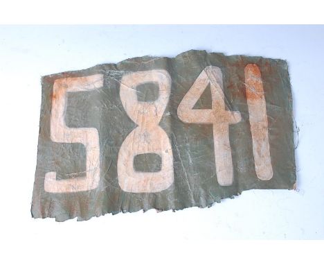 A patch of canvas numbered 5841, possibly RFC. 27 x 42cm.