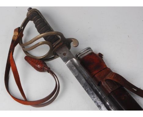 An 1897 pattern Royal Artillery Officer's sword, the 89cm blade etched with a crowned GR cypher within foliage, having a regu