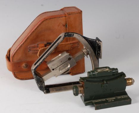 A WW II Clinometer Field Mk IV No. 299IC, having an adjustable spirit level with 0-45 degree scale, in a brown leather Clinom