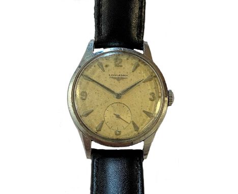 circa 1956, model 7035-8, the signed circular cream coloured dial, 30mm diameter, with silver coloured quatre Arabic numerals