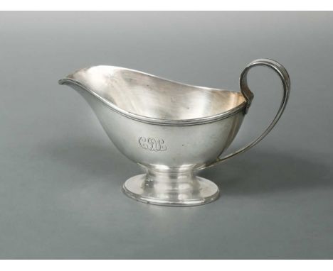of traditional form with reeded rim and handle, raised on a reeded pedestal foot, stamped to the underside TIFFANY &amp; CO 2